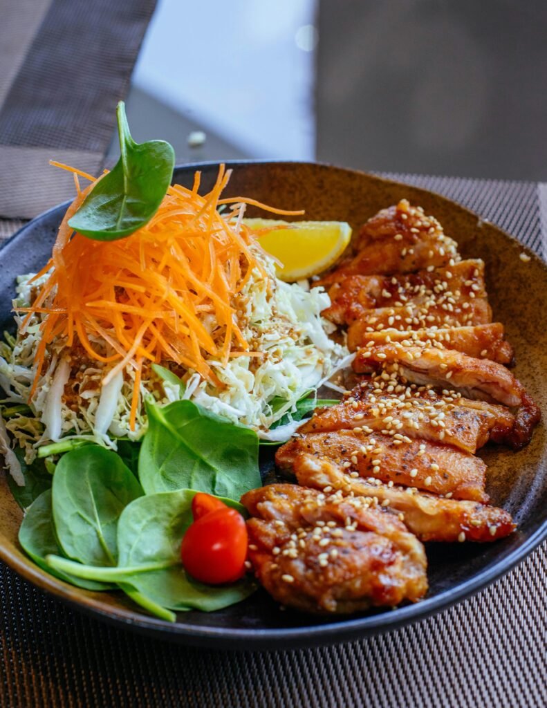 pexels-photo-1860204-1860204 Vibrant Asian salad with grilled chicken, perfect for healthy eating enthusiasts.